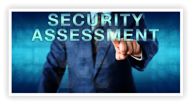 A man in a suit pointing to the words security assessment.