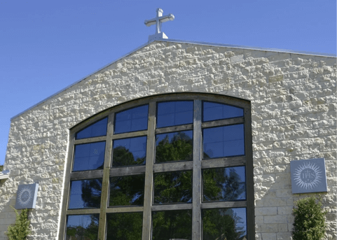 A church with a cross on top of it