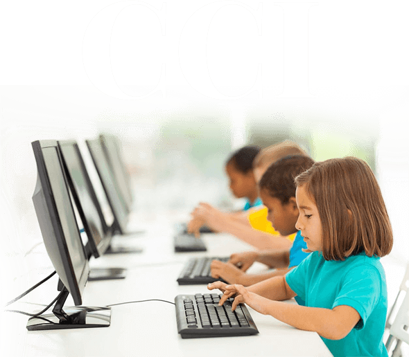 A group of children sitting at computers in front of the words " ccl ".